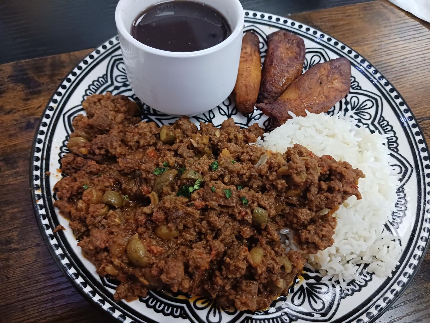Picadillo with white rice, sweet plantains and black beans