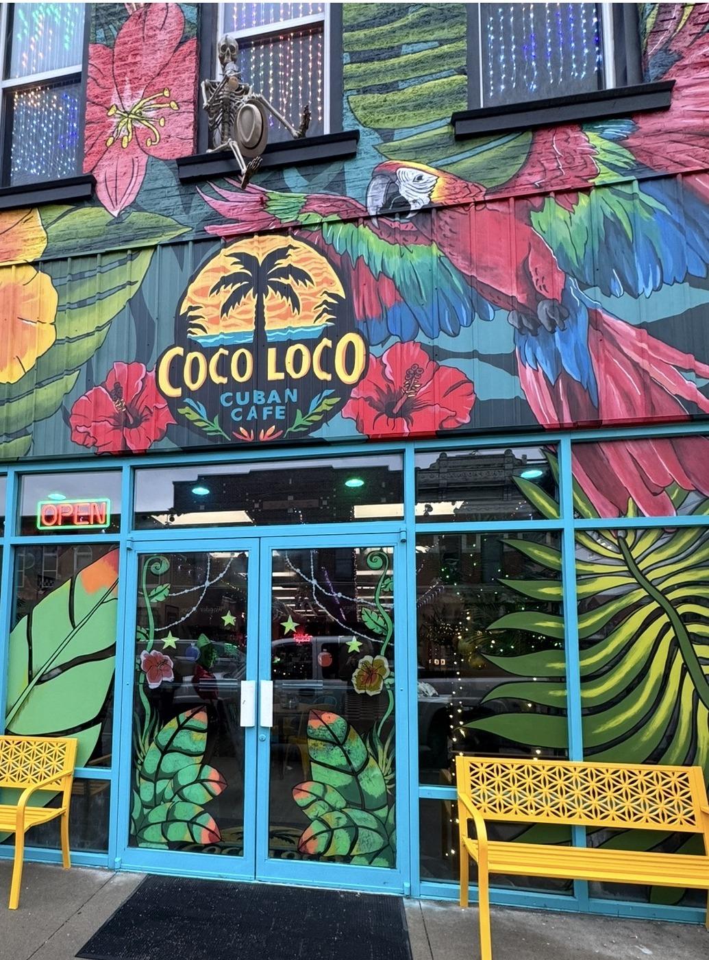 The storefront lit up in the evening
